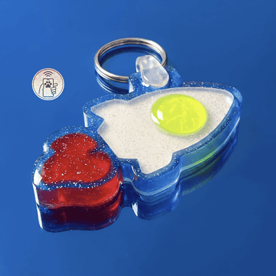 NFC pet ID tag in blue and red acrylic shapes for dogs and cats, featuring a keyring attachment.