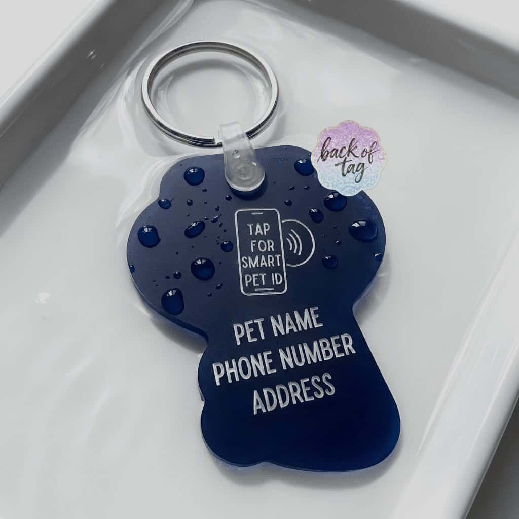 NFC pet ID tag in a playful dog shape with space for pet details and smart technology.