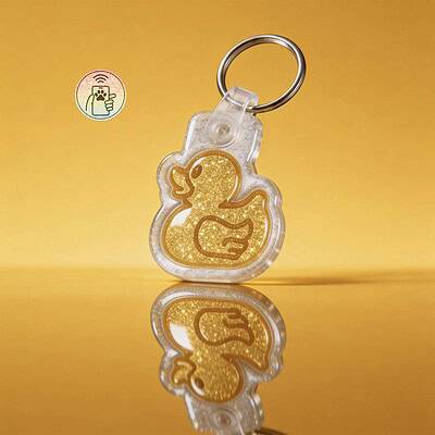 Glittery rubber duck-shaped NFC pet ID tag for dogs and cats with keyring.