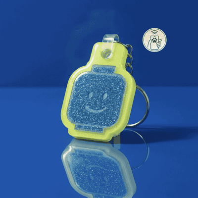 NFC pet ID tag in bright yellow with a smiling face, designed for dogs and cats — Shiloh's House smart NFC pet tag with free companion Lohji app.