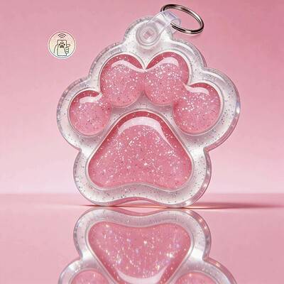 Pink paw-shaped NFC pet ID tag with glitter for dogs and cats.
