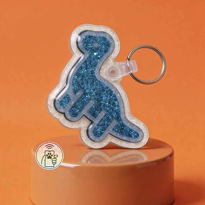NFC pet ID tag in dinosaur shape with blue glitter finish for dogs and cats.