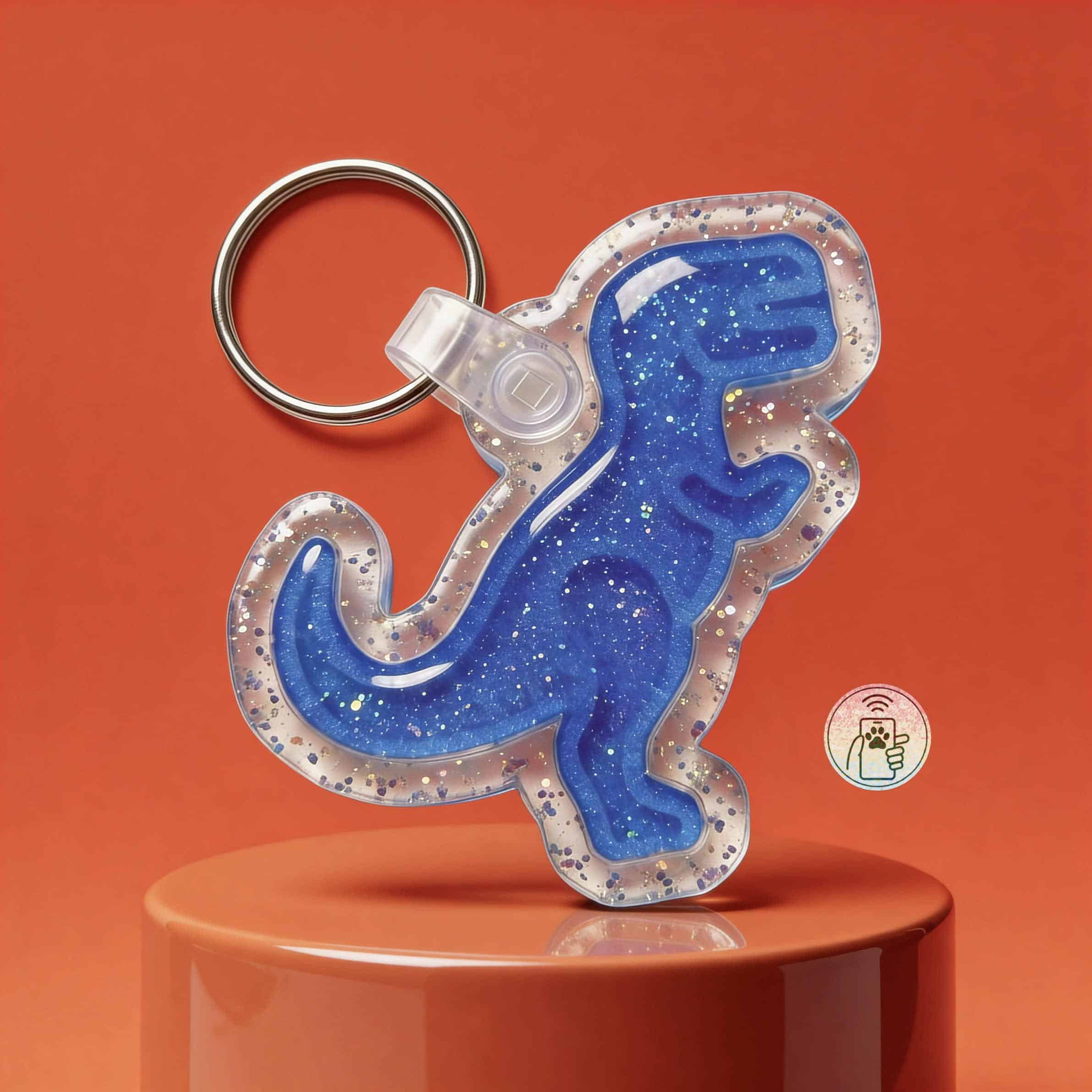 Blue glitter dinosaur-shaped NFC pet ID tag with keyring for dogs and cats.