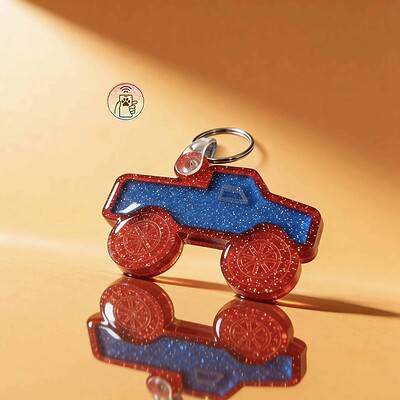 NFC pet ID tag shaped like a tractor with glittery red and blue acrylic, designed for dogs and cats.