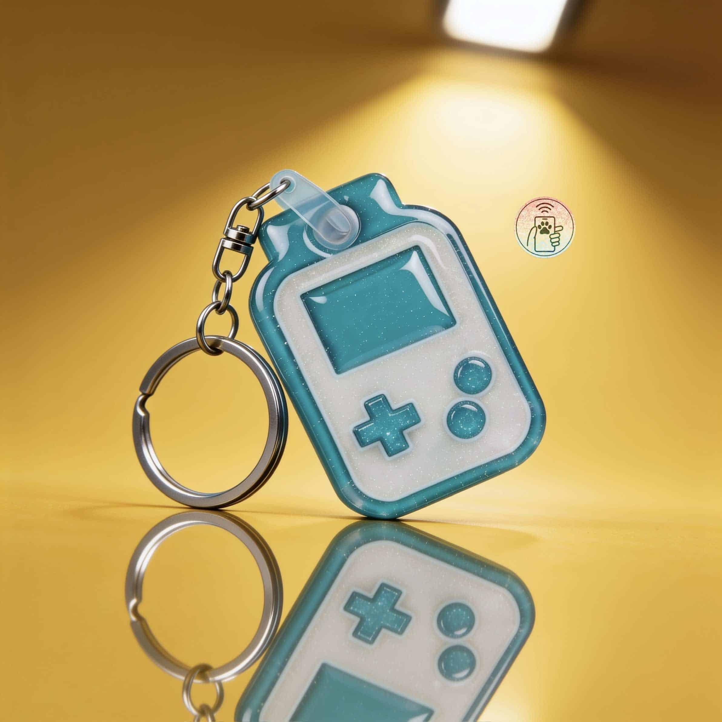NFC pet ID tag in a playful gaming device shape with keyring for dogs and cats.