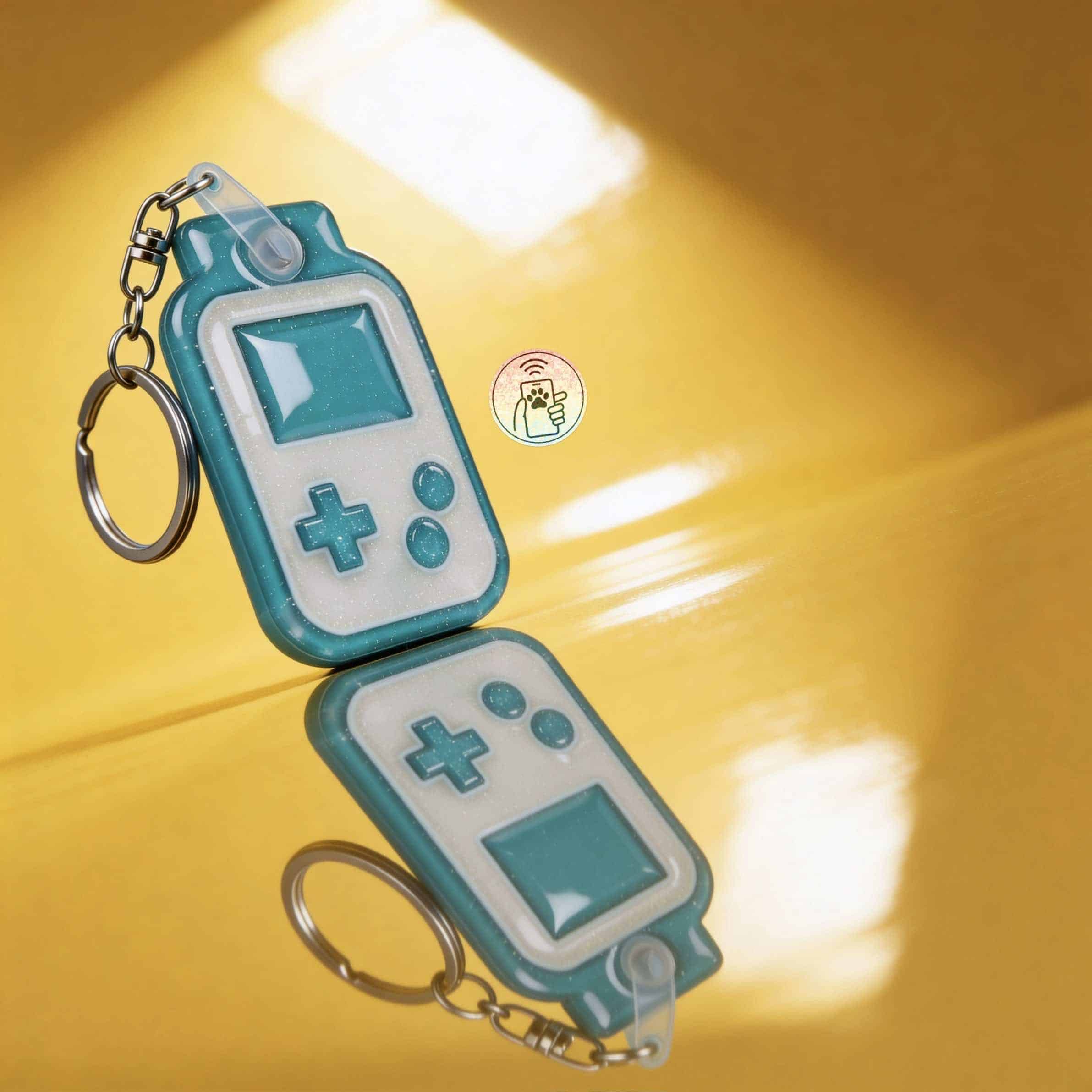NFC pet ID tag shaped like a game controller with keychain for dogs and cats.