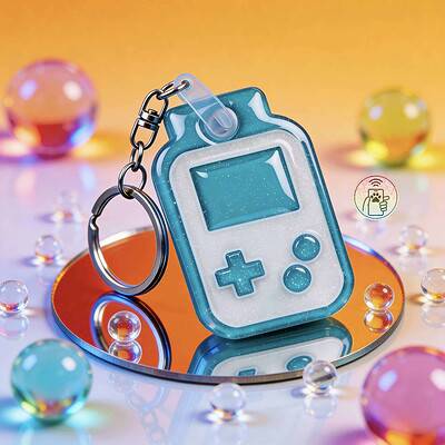 Bright blue and white pet ID tag resembling a retro gaming console with a keyring.
