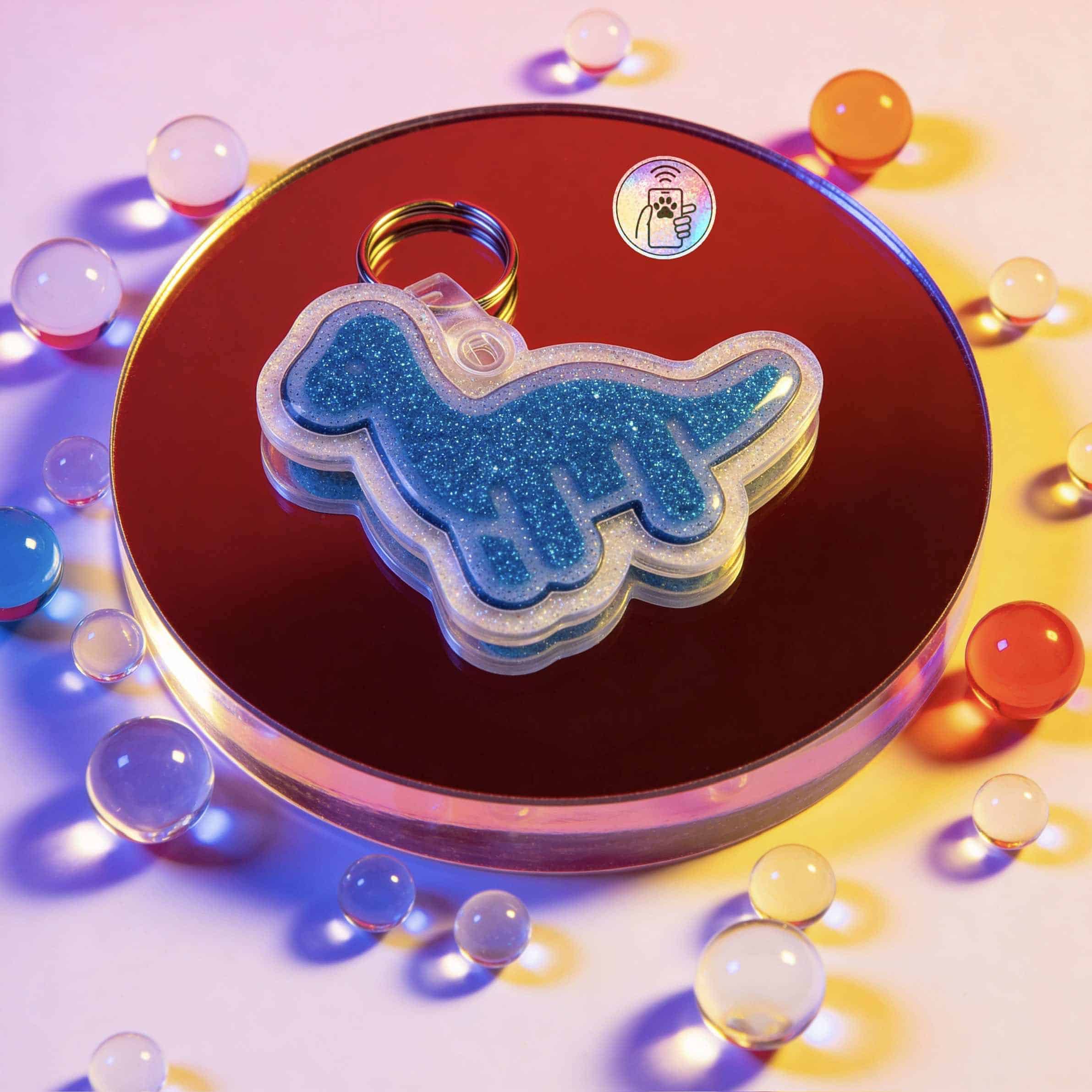 NFC pet ID tag shaped like a unicorn, designed for dogs and cats, with a glittery blue finish — Shiloh's House smart NFC pet tag with free companion Lohji app.