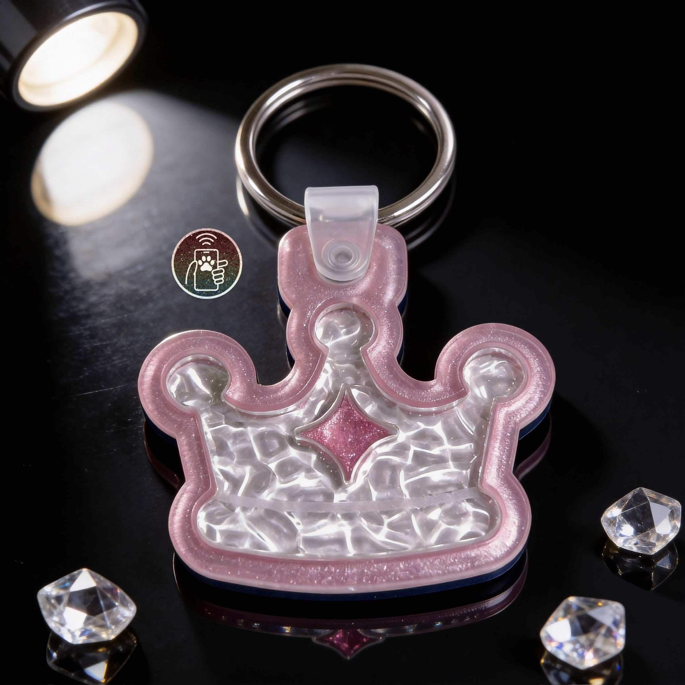 Pink crown-shaped NFC pet ID tag for dogs and cats with keyring attachment — Shiloh's House smart NFC pet tag with free companion Lohji app.