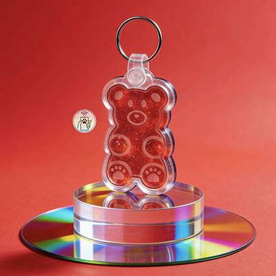 NFC pet ID tag shaped like a teddy bear, made of clear acrylic with red glitter, designed for dogs a — Shiloh's House smart NFC pet tag with free companion Lohji app.