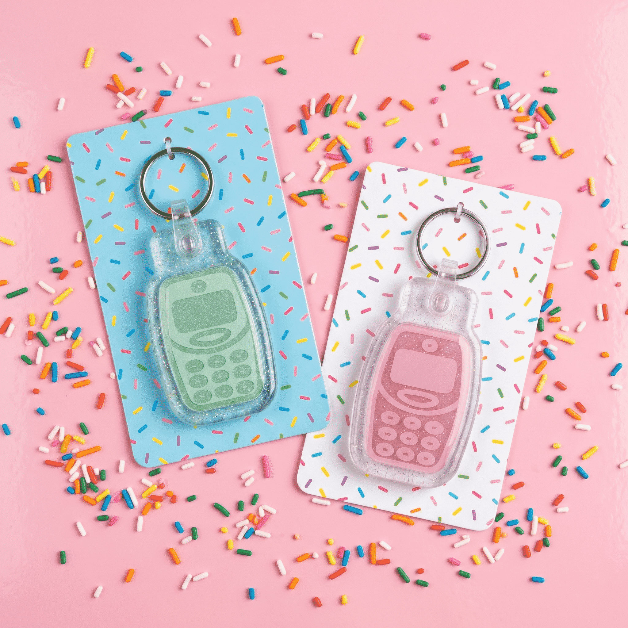 Bright NFC pet ID tags in blue and pink with phone shape, attached to cards with sprinkles — Shiloh's House smart NFC pet tag with free companion Lohji app.