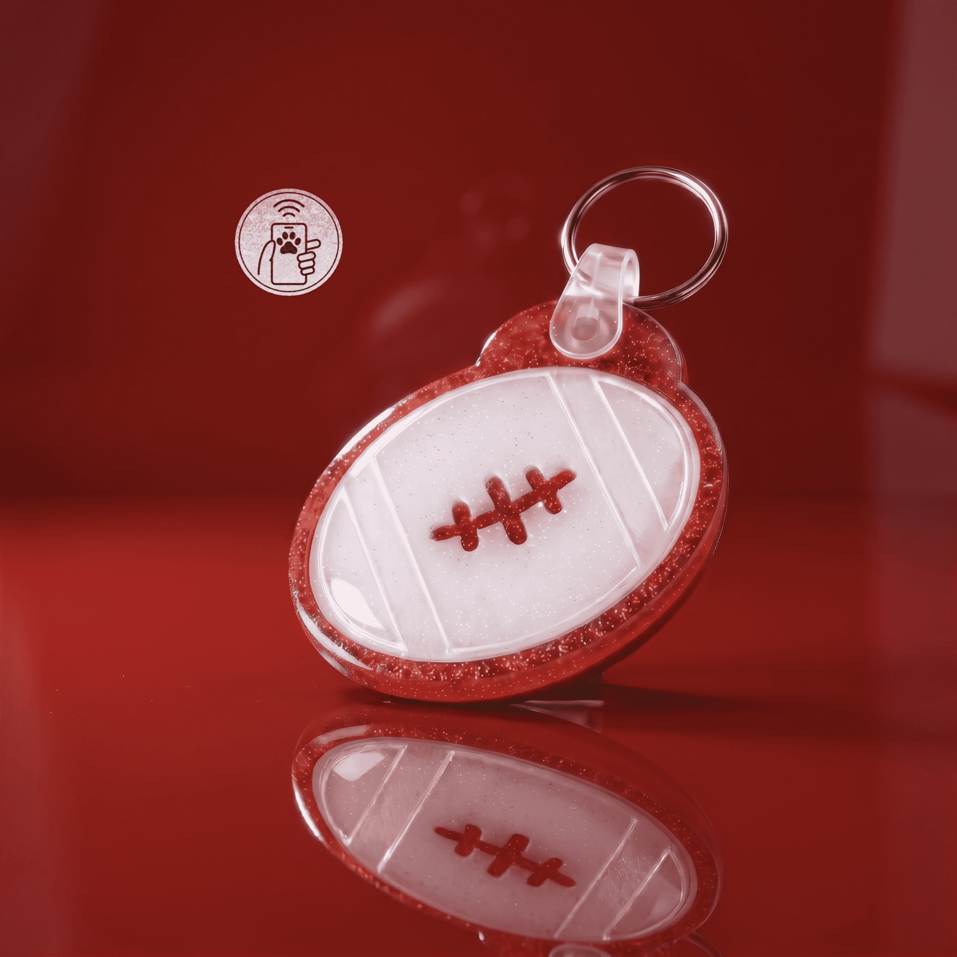 NFC pet ID tag shaped like a football with red stitching, designed for dogs and cats — Shiloh's House smart NFC pet tag with free companion Lohji app.