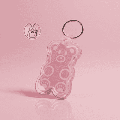 NFC pet ID tag in the shape of a pink bear with a keyring, perfect for dogs and cats — Shiloh's House smart NFC pet tag with free companion Lohji app.