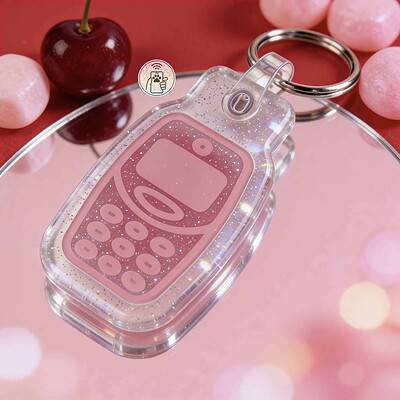 NFC pet ID tag in a phone shape with glitter, perfect for pet safety and identification — Shiloh's House smart NFC pet tag with free companion Lohji app.