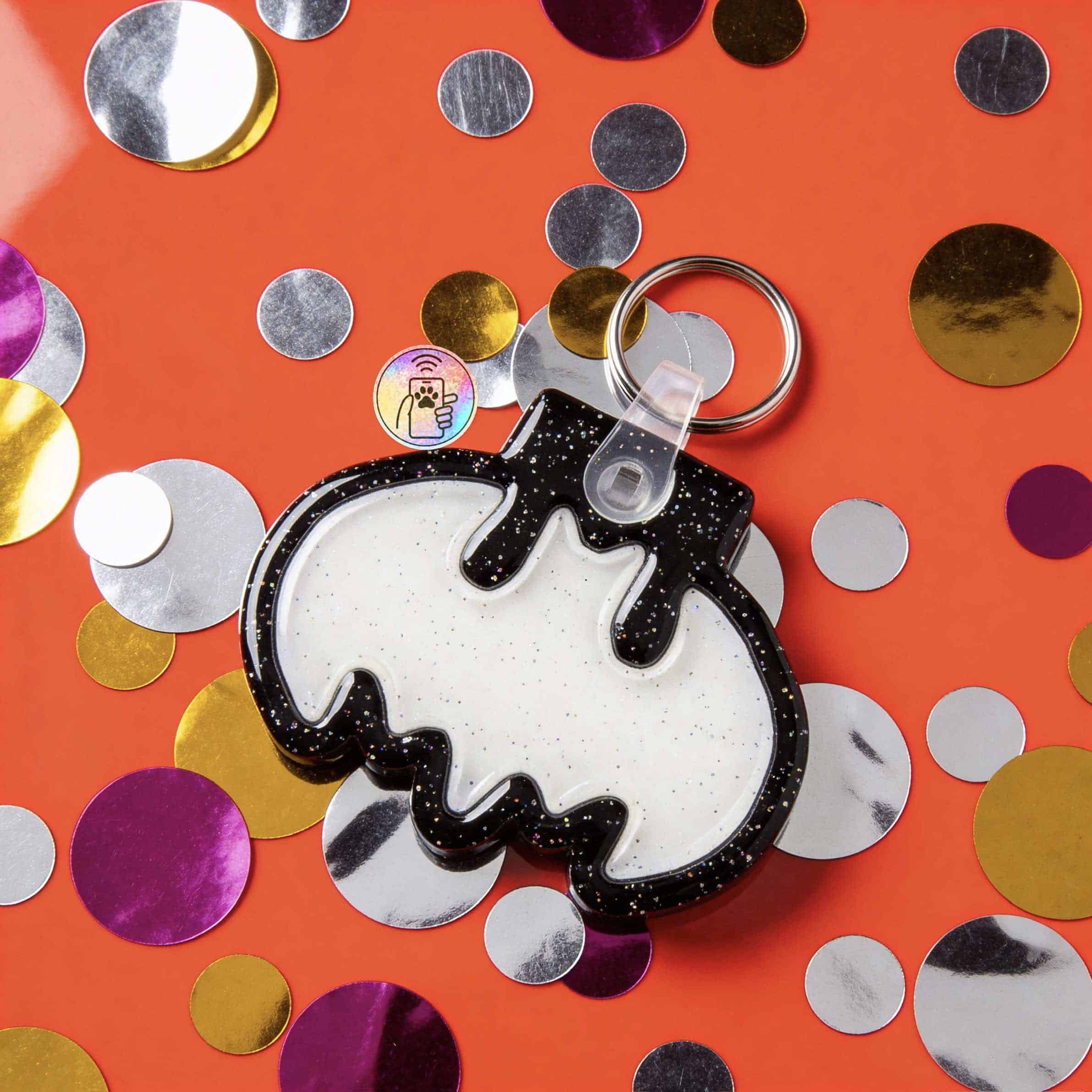 NFC pet ID tag shaped like a bat, perfect for dogs and cats, with a keyring attachment — Shiloh's House smart NFC pet tag with free companion Lohji app.