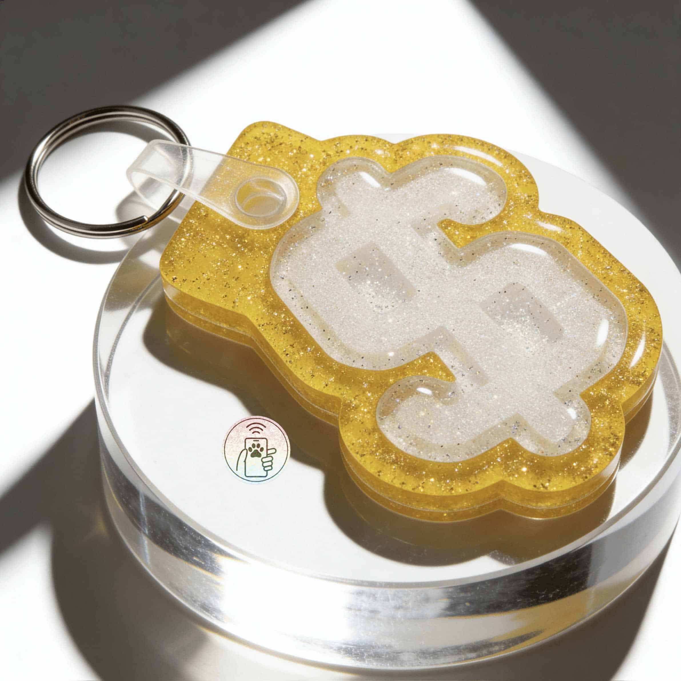 Gold glitter pet ID tag in dollar sign shape with NFC chip for dogs and cats — Shiloh's House smart NFC pet tag with free companion Lohji app.