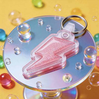 Pink glitter lightning bolt-shaped NFC pet ID tag for dogs and cats — Shiloh's House smart NFC pet tag with free companion Lohji app.