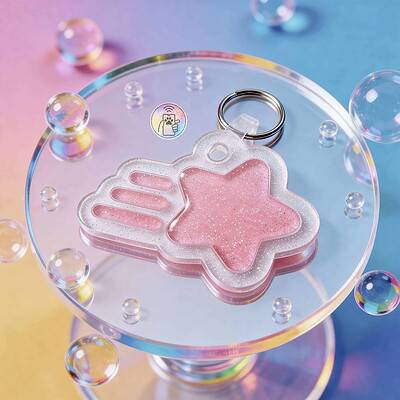 NFC pet ID tag shaped like a pink unicorn with glitter, on a clear acrylic display with colorful bub — Shiloh's House smart NFC pet tag with free companion Lohji app.