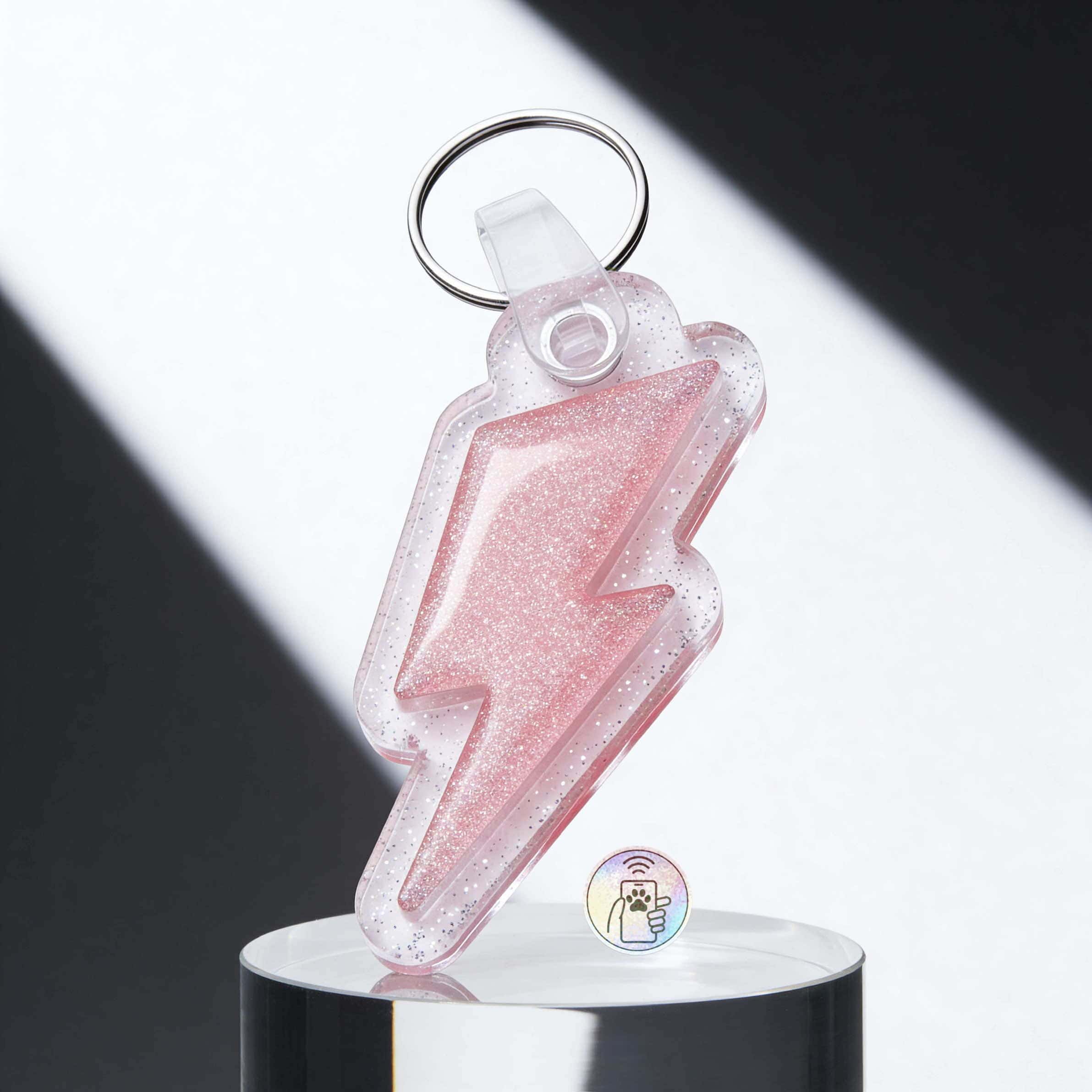 Cute pink glitter lightning bolt-shaped pet ID tag with keyring for dogs and cats — Shiloh's House smart NFC pet tag with free companion Lohji app.