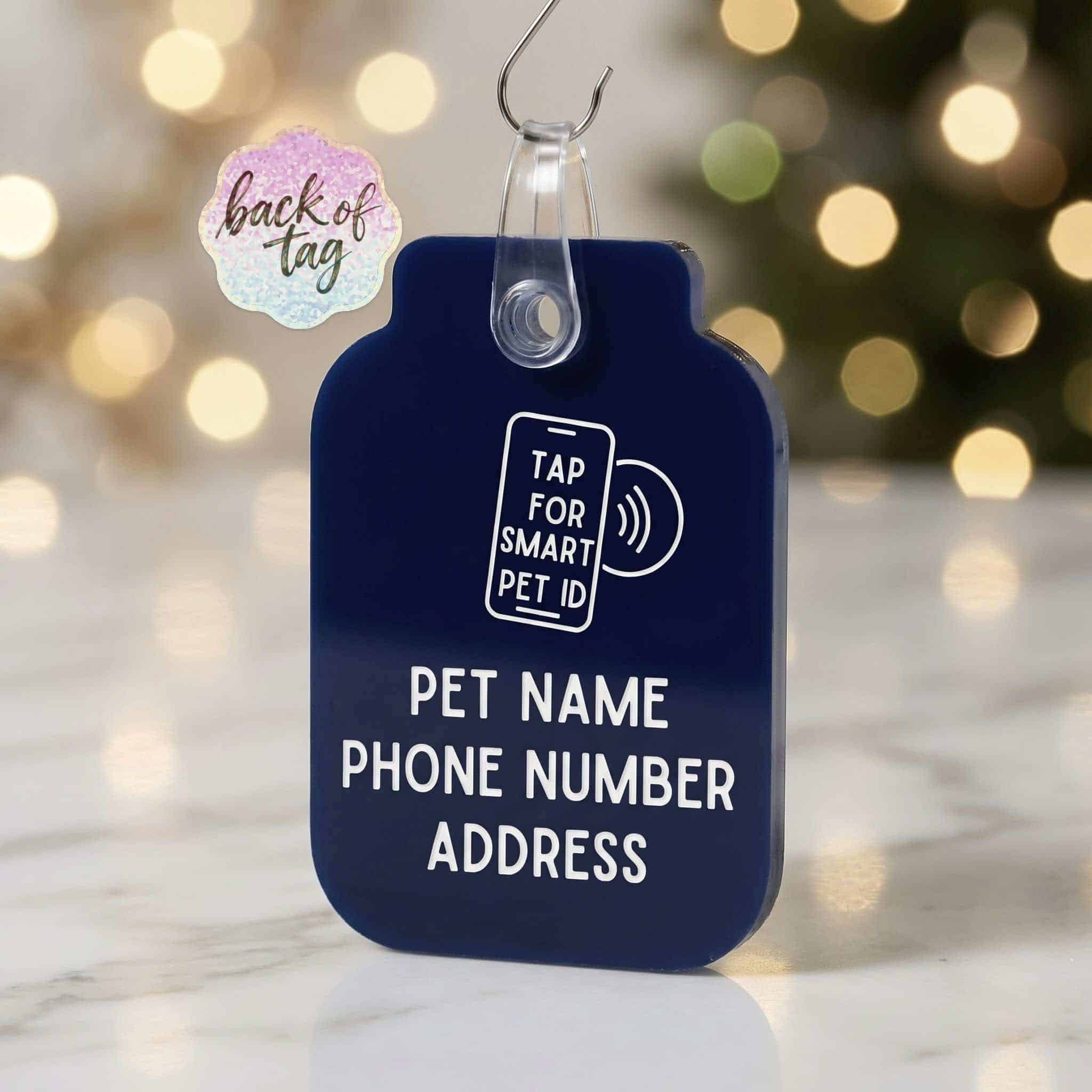 NFC pet ID tag in blue acrylic with space for pet's name, phone, and address.