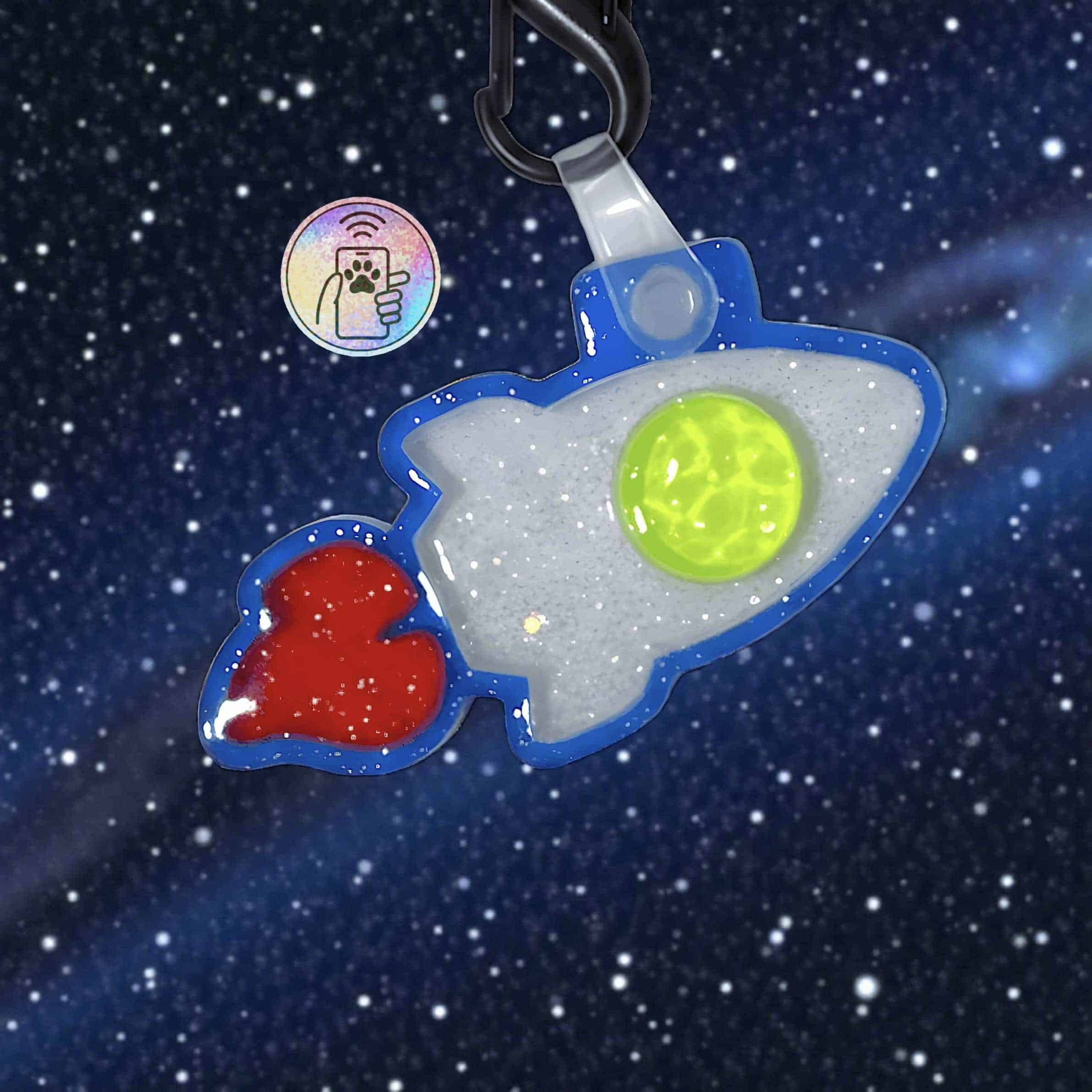 NFC pet ID tag shaped like a rocket with glow-in-the-dark features for dogs and cats.
