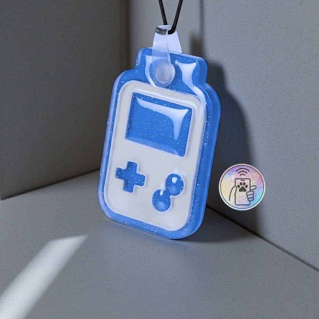 NFC pet ID tag in a playful gaming device shape, perfect for dogs and cats' identification.