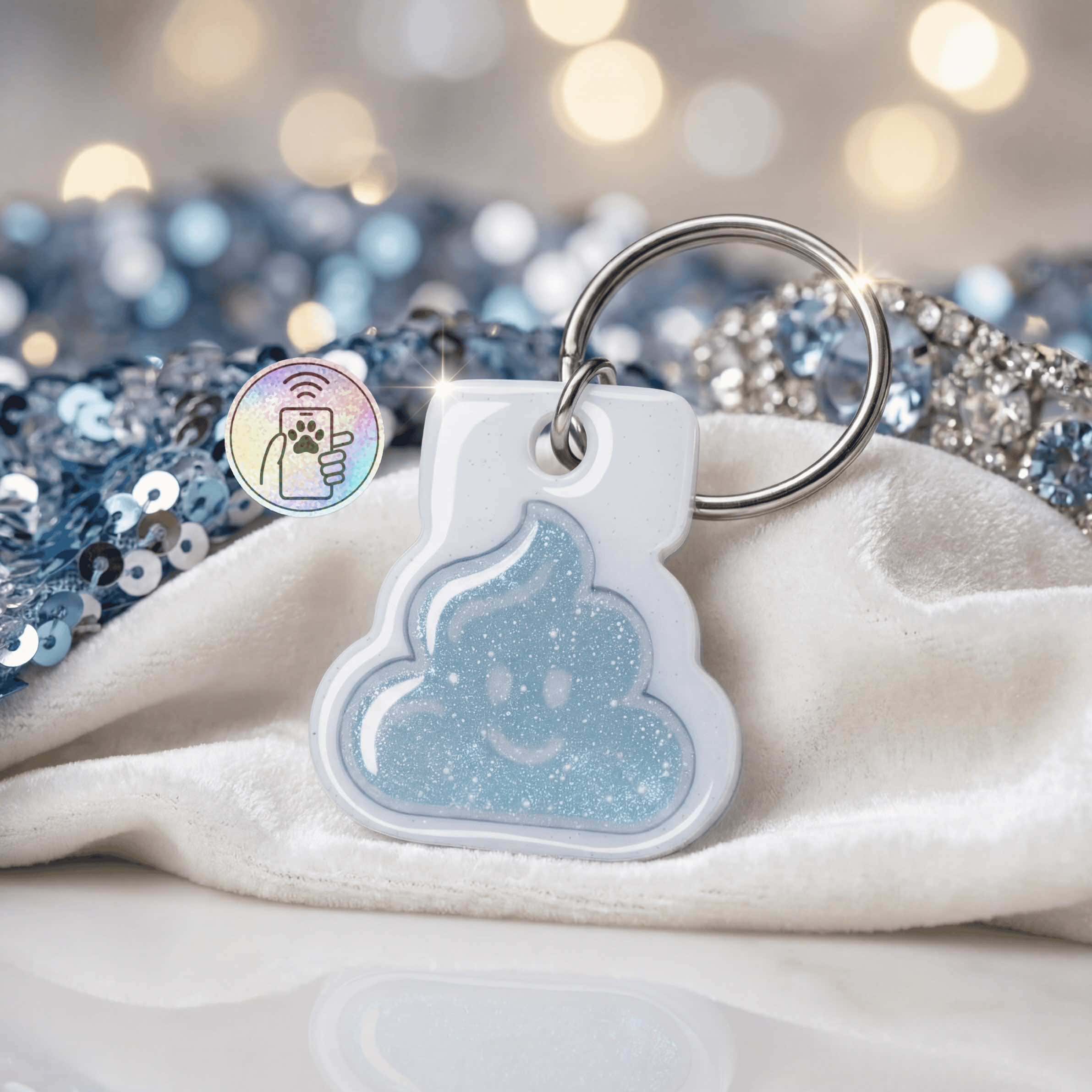 NFC pet ID tag shaped like a poop emoji with a glittery blue finish, perfect for dogs and cats.