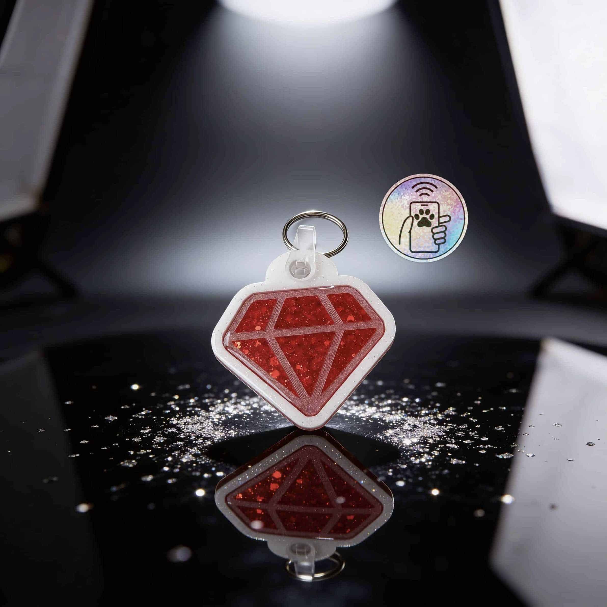 NFC pet ID tag shaped like a red diamond for dogs and cats, designed for easy scanning and identific.