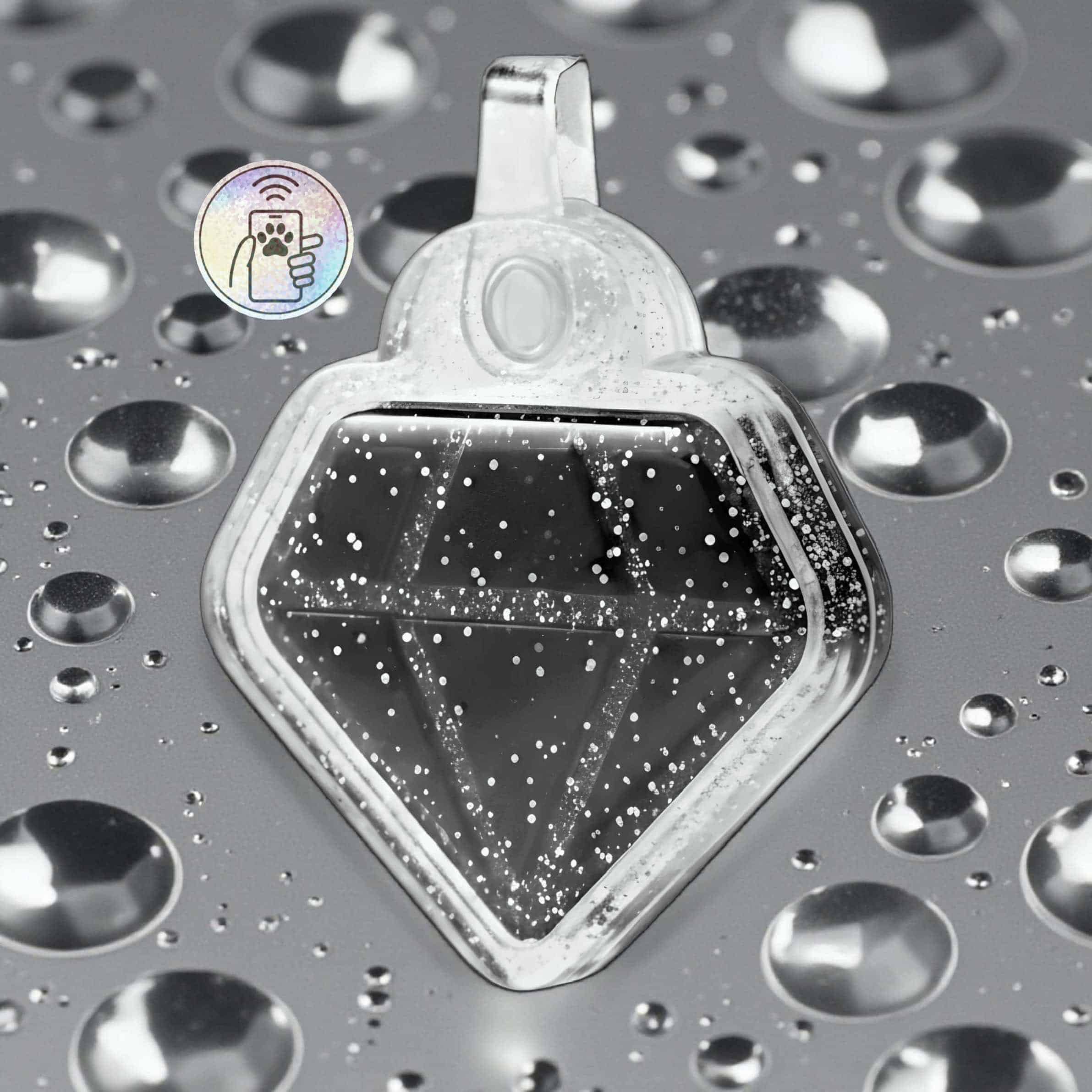 Clear diamond-shaped NFC pet ID tag with water droplets on a reflective surface.