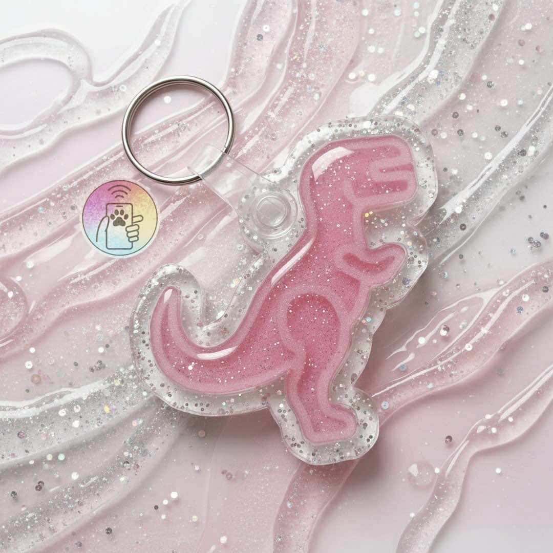 NFC pet ID tag shaped like a pink dinosaur with glitter, ideal for dogs and cats.