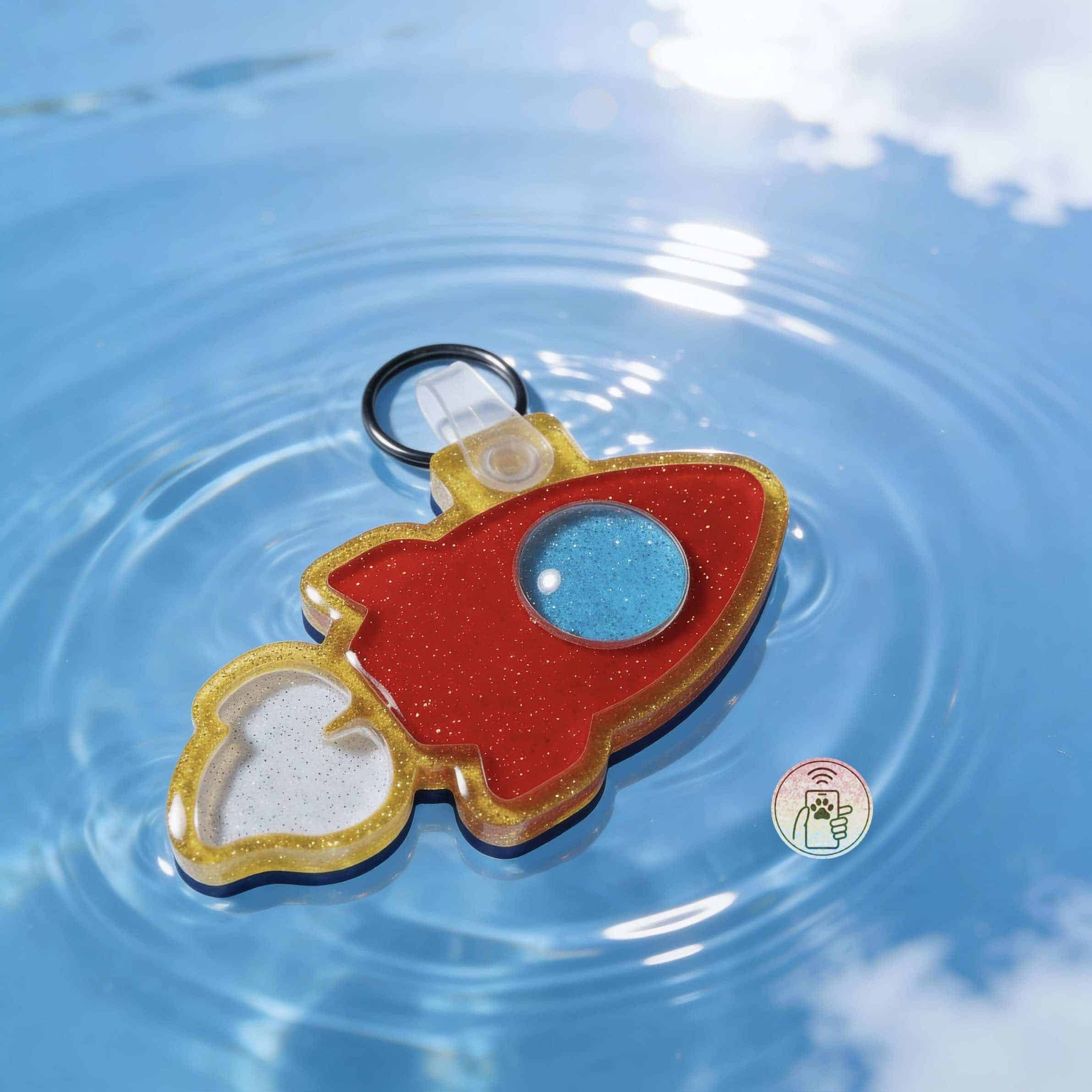 NFC pet ID tag shaped like a rocket, designed for dogs and cats, with a colorful, playful appearance — Shiloh's House smart NFC pet tag with free companion Lohji app.