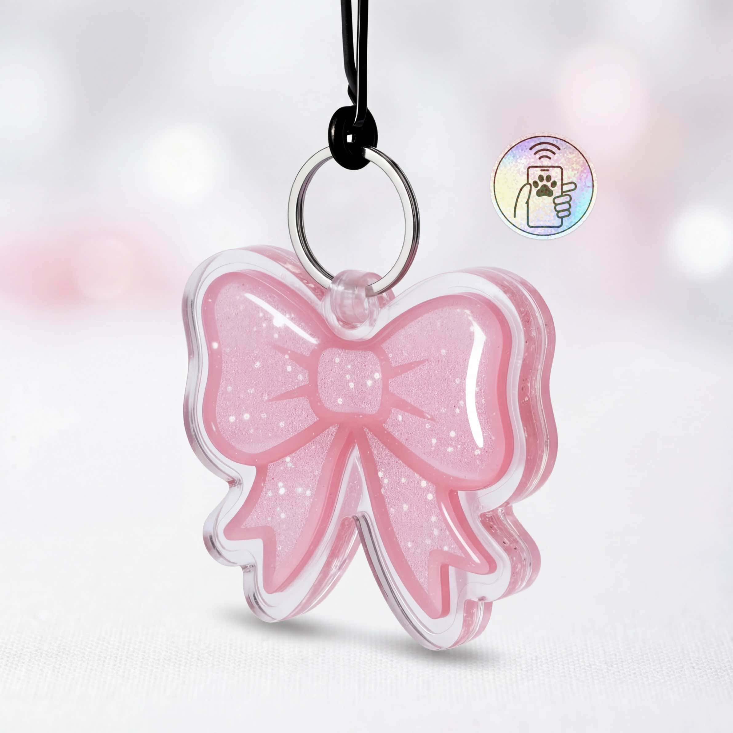 NFC pet ID tag shaped like a pink bow, designed for dogs and cats, with smart tracking features.