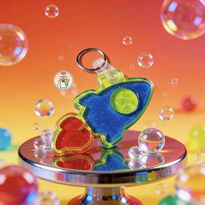 Brightly colored rocket-shaped NFC pet ID tag with a heart, designed for dogs and cats, displayed wi.