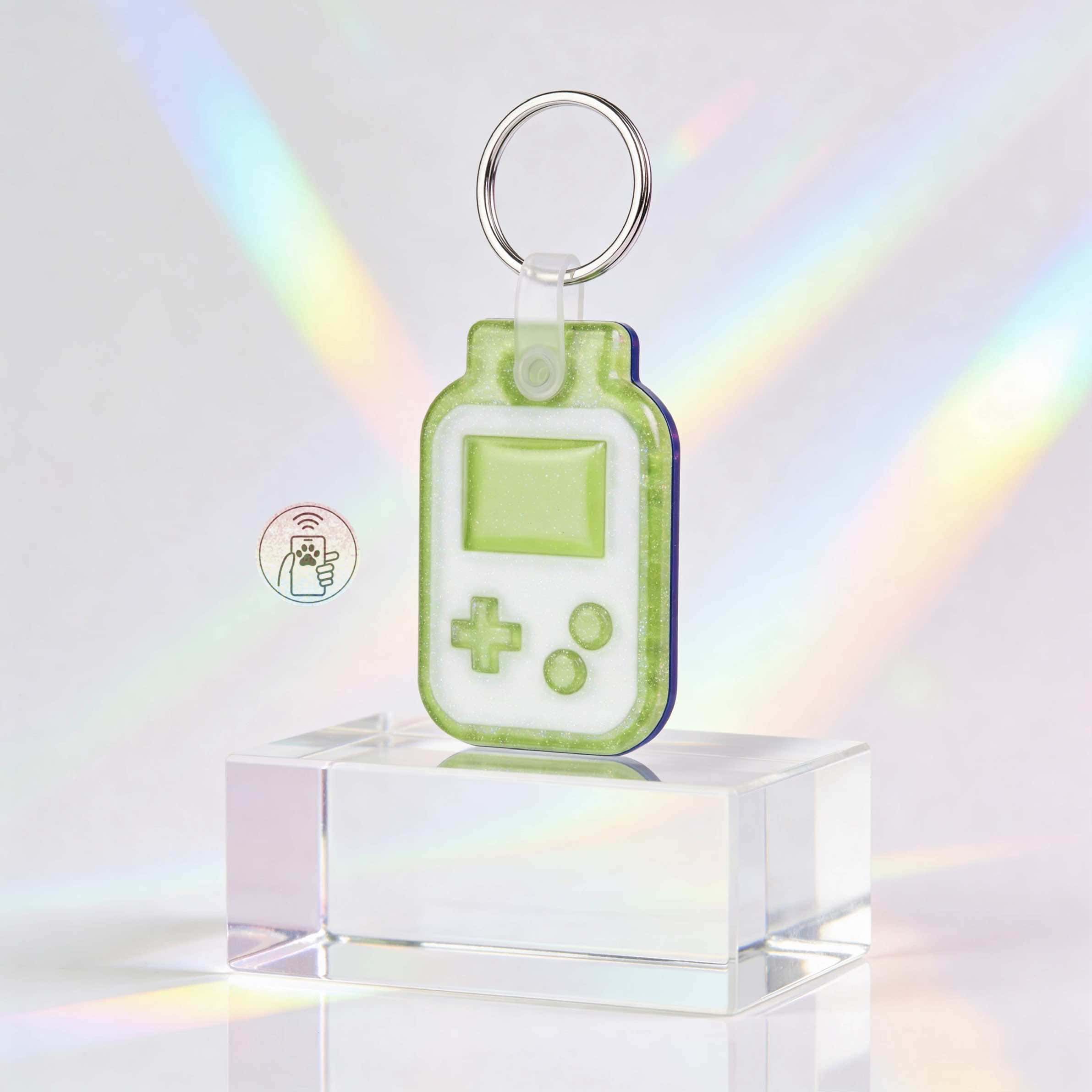 NFC pet ID tag shaped like a handheld game console in bright neon green for pets — Shiloh's House smart NFC pet tag with free companion Lohji app.