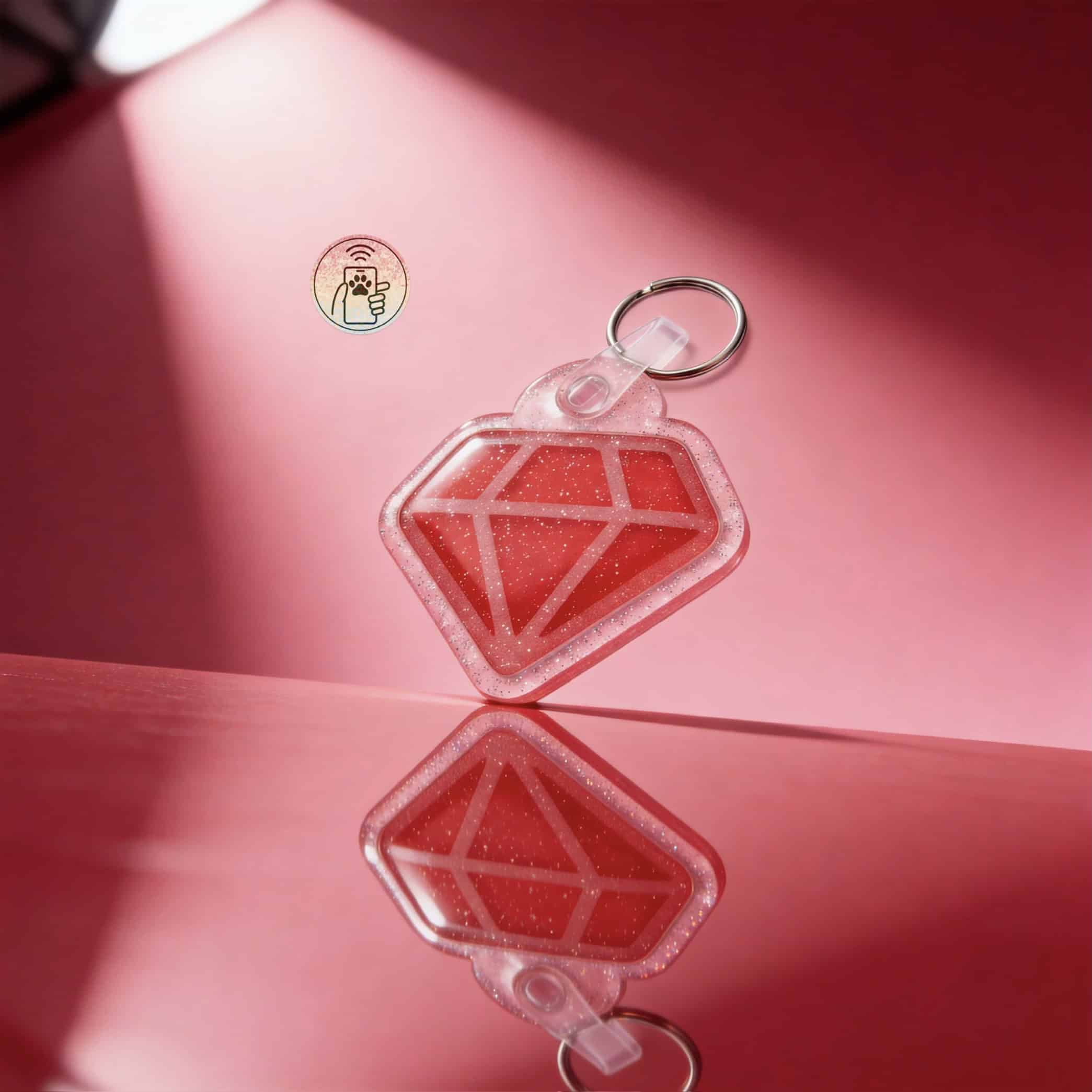 Clear acrylic diamond-shaped NFC pet ID tag with red glitter, attached to a keyring.