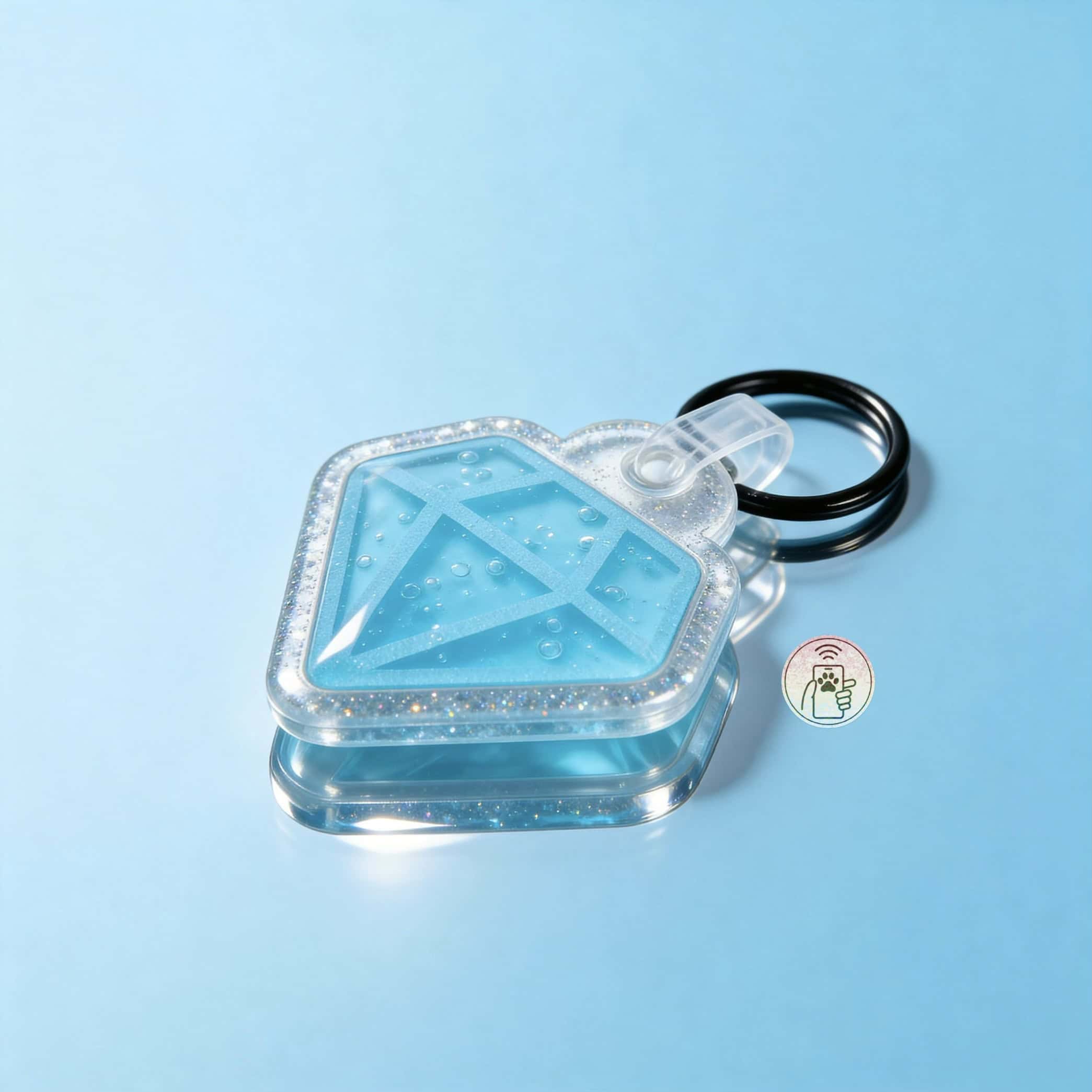 NFC pet ID tag shaped like a house with a blue acrylic surface and a black keyring.