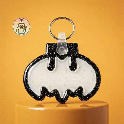 A glow-in-the-dark Batman-shaped NFC pet ID tag with black and white design, perfect for dogs and ca.