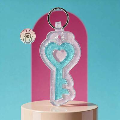 NFC pet ID tag in a heart shape with glittery blue acrylic, perfect for dogs and cats.