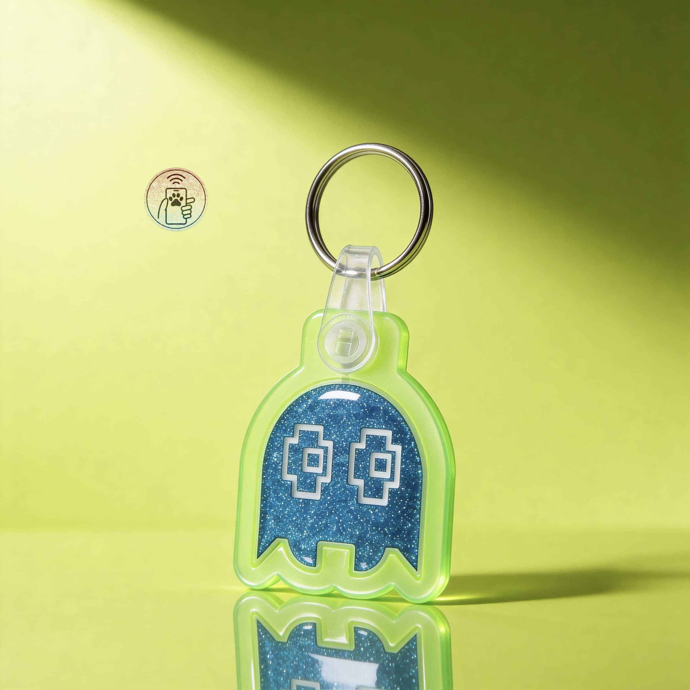 Bright green ghost-shaped NFC pet ID tag with glittery blue interior on a lime green background.