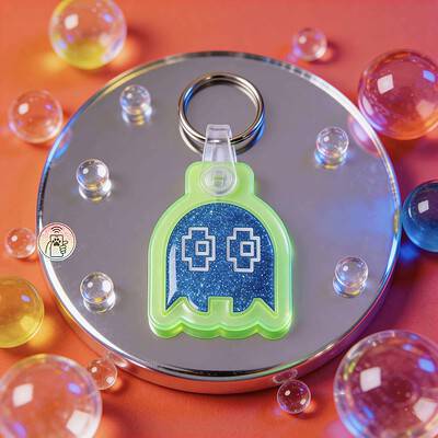 Neon green ghost-shaped NFC pet ID tag with blue glitter background for dogs and cats.