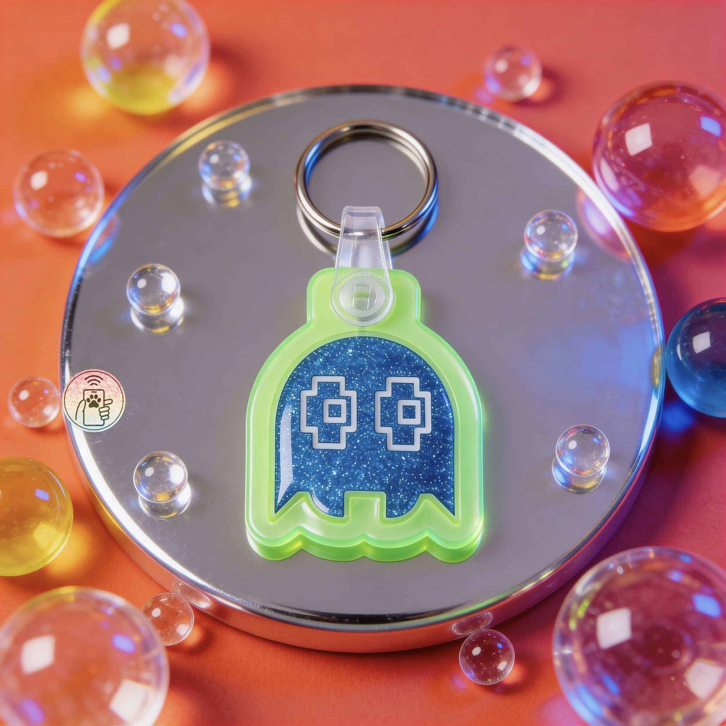 Neon green ghost-shaped NFC pet ID tag with blue glitter background for dogs and cats.