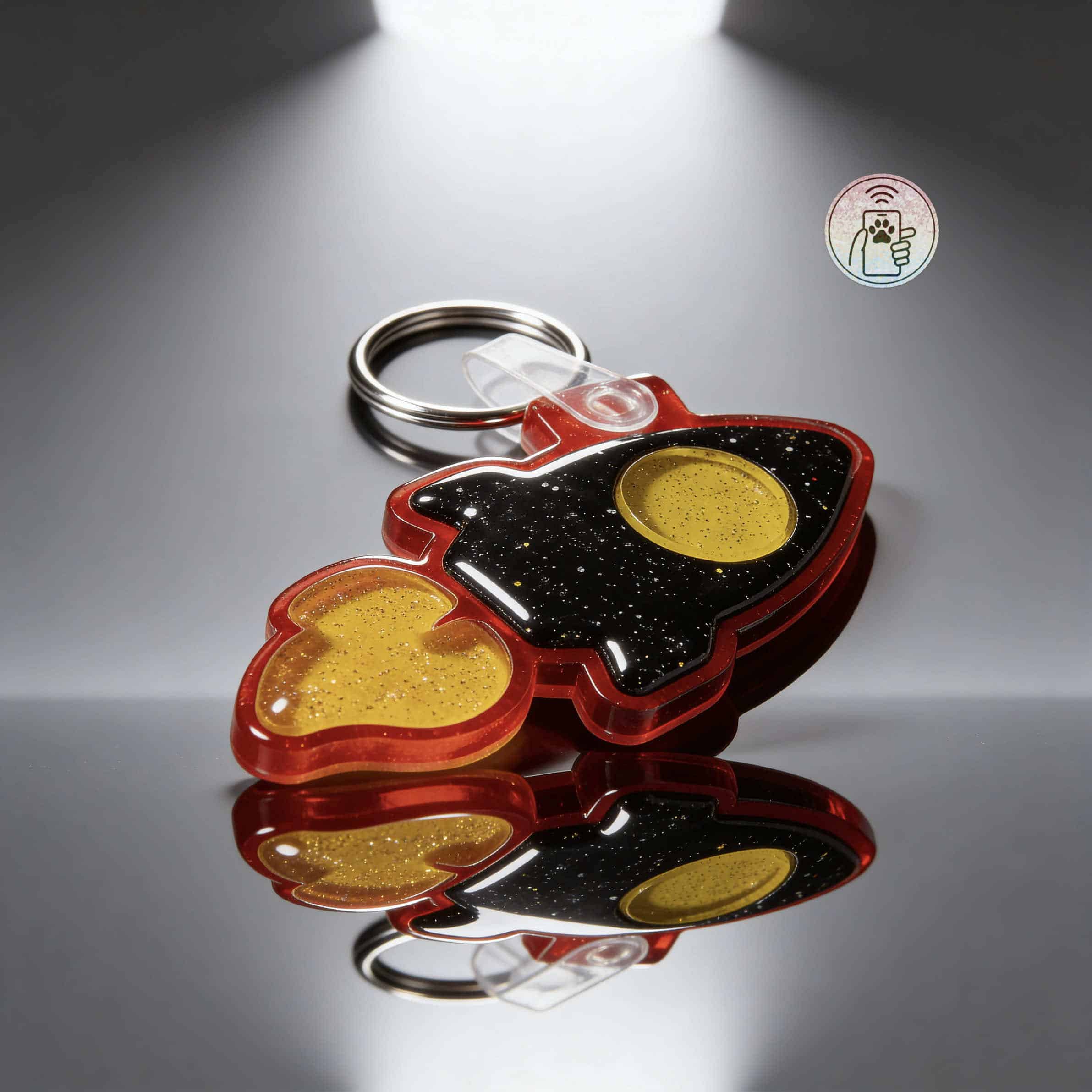 NFC pet ID tag shaped like a rocket with black, yellow, and red acrylic, designed for dogs and cats.