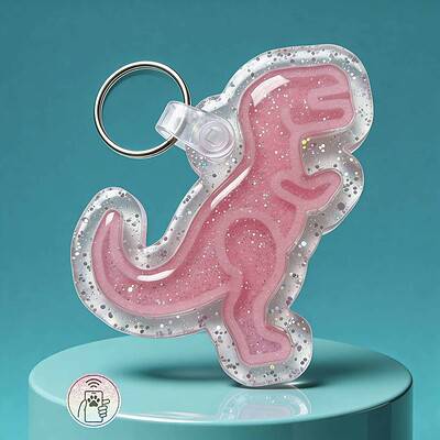 NFC pet ID tag in pink dinosaur shape with clear border and bubble accents.