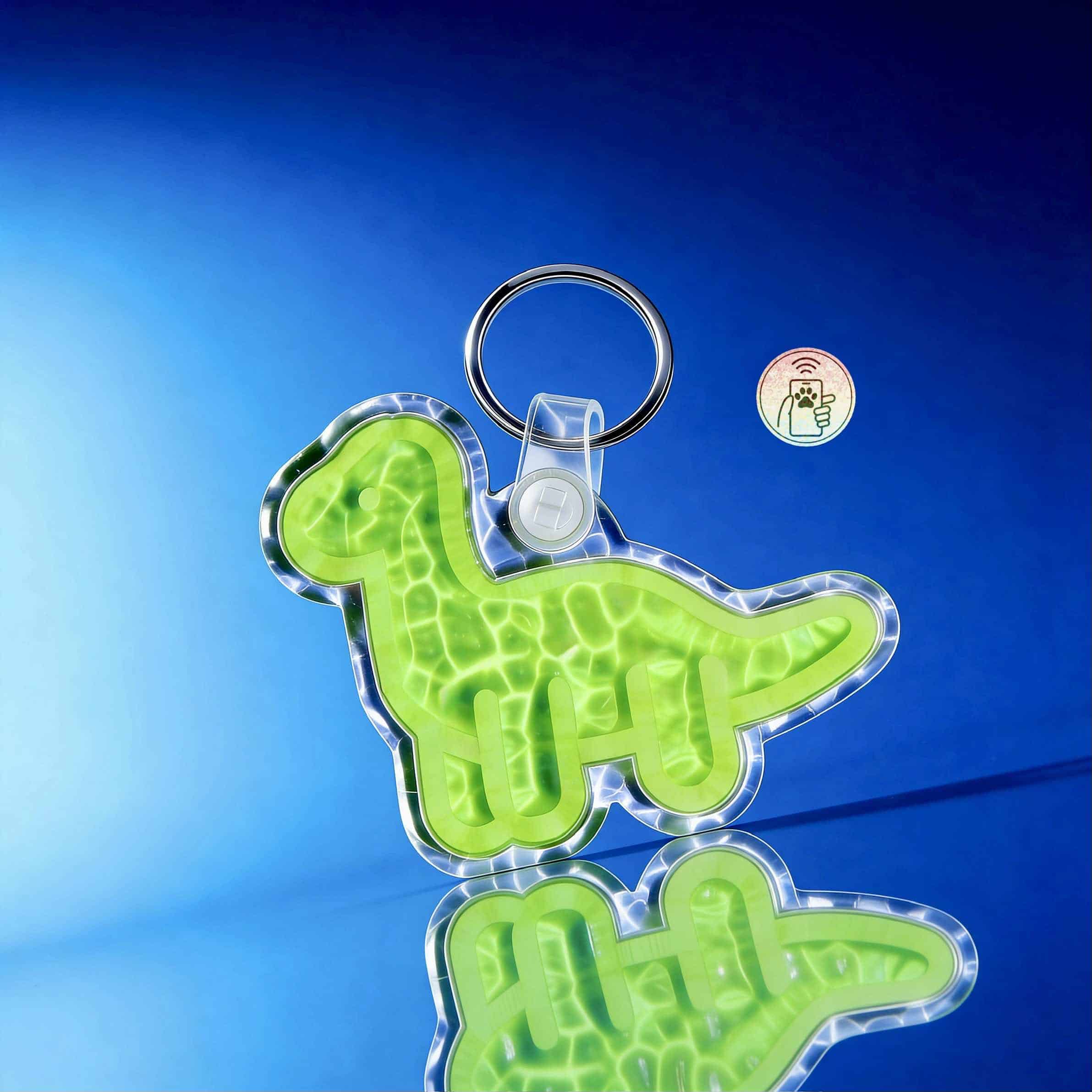 NFC pet ID tag in dinosaur shape with keyring, designed for dogs and cats' identification.
